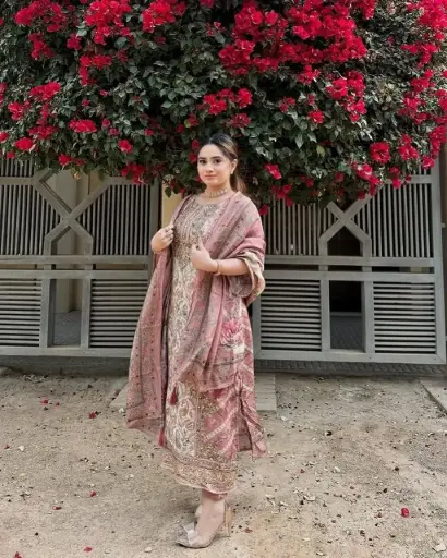 Stylish Dusty Rose Colour Muslin Printed Suit